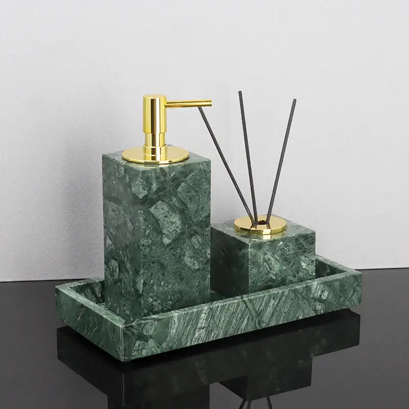 Green Indian marble bathroom accessories set with gold pump soap dispenser on a matching tray