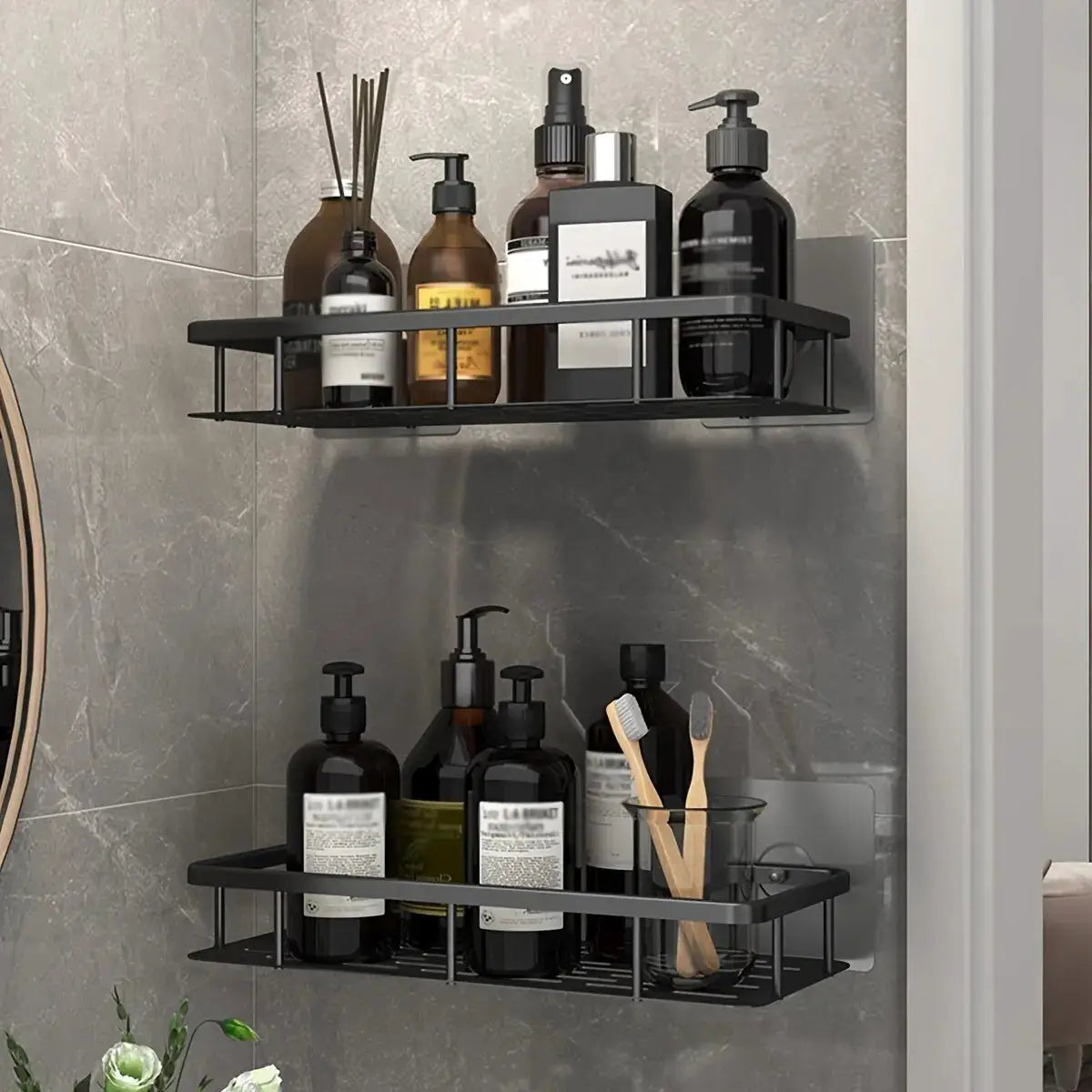Bathroom storage rack, black two-tier wall-mount corner shelf by Simples Market, holding shampoo bottles.