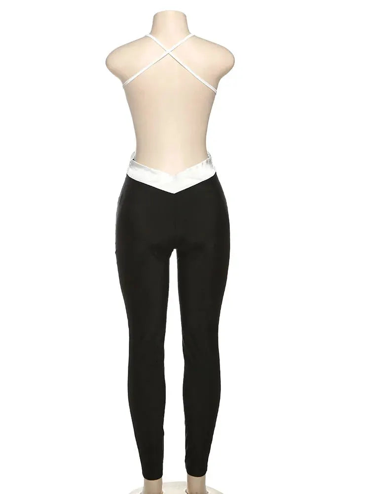 kliou cross-strap backless jumpsuit, black skinny pants with white waistband