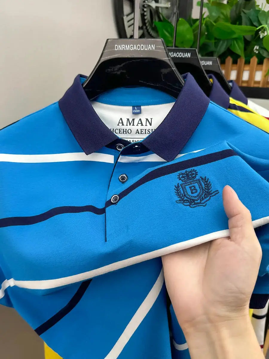 Men's blue striped polo shirt with navy collar and crest embroidery