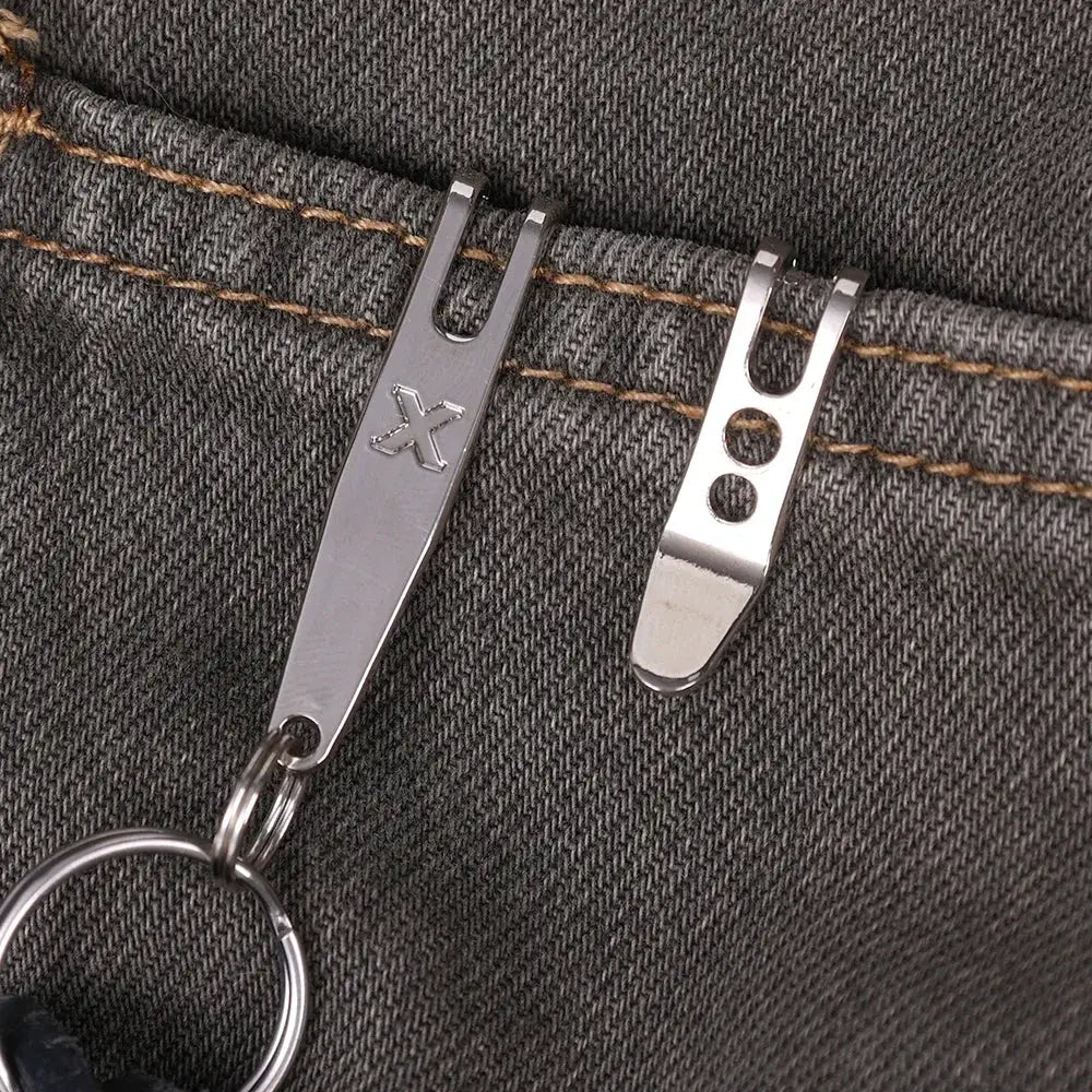 Simples Market EDC pocket suspension clips with key carabiner, two silver metal clips attached to a denim pocket.
