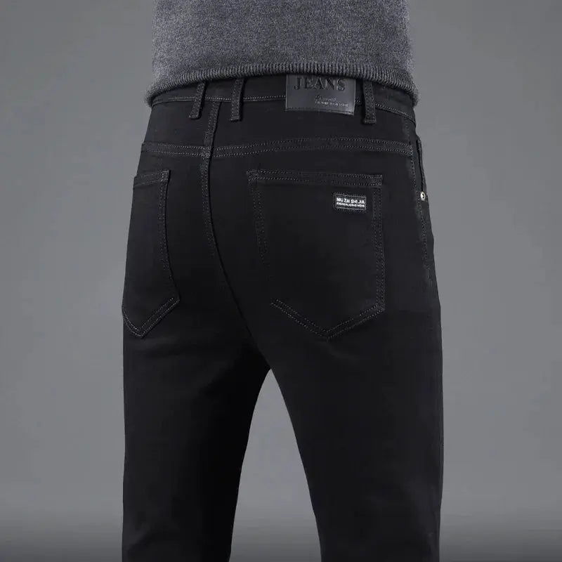 Men's black denim jeans, slim fit with back pockets and stitched detailing