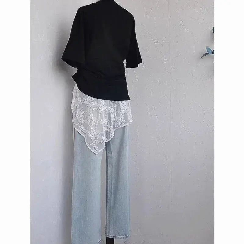 Wrap lace skirt with layered white lace overlay, shown with light-wash wide-leg jeans (back view)