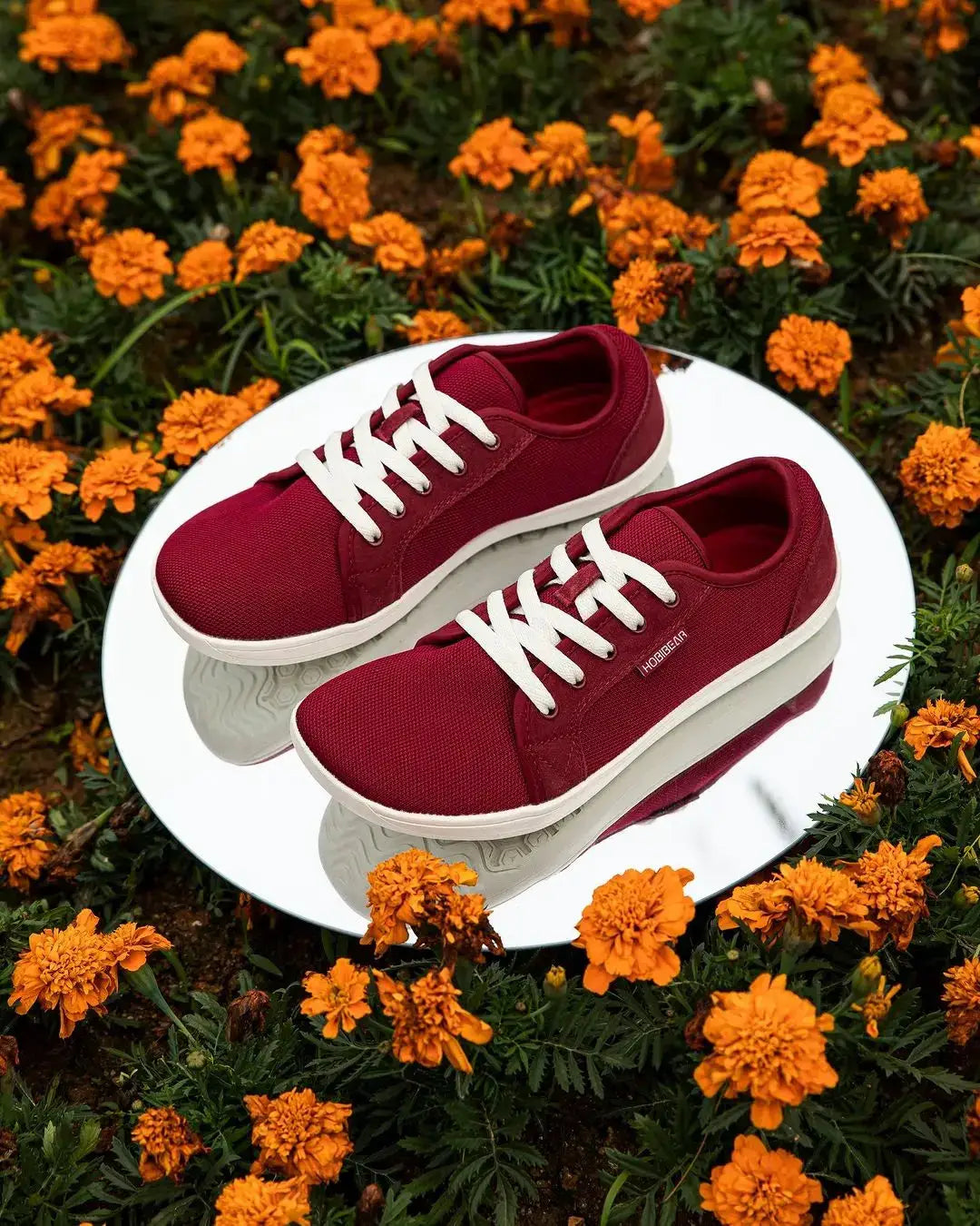 HOBIBEAR unisex wide-toe barefoot shoes, burgundy with white laces, lightweight breathable pair on mirror