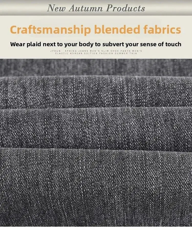 Men's black straight-stretch denim jeans fabric close-up; dense weave