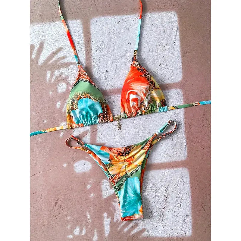Bikini set by Simples Market, sexy leopard-print push-up two-piece with triangle top and thong bottom.