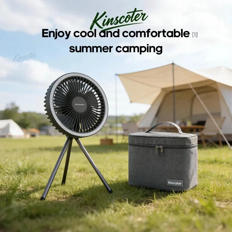 Kinscoter camping fan on a tripod beside a gray cooler at a campsite