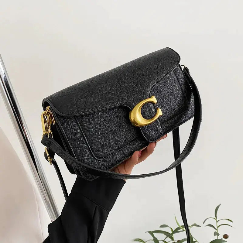 Double-Strap Small Square Crossbody Bag in pebbled black leather with gold-tone crescent clasp
