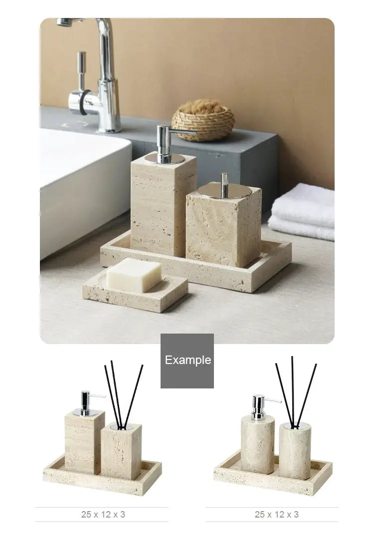 Beige travertine bathroom accessories set with soap dispenser, soap dish, reed diffuser on vanity tray