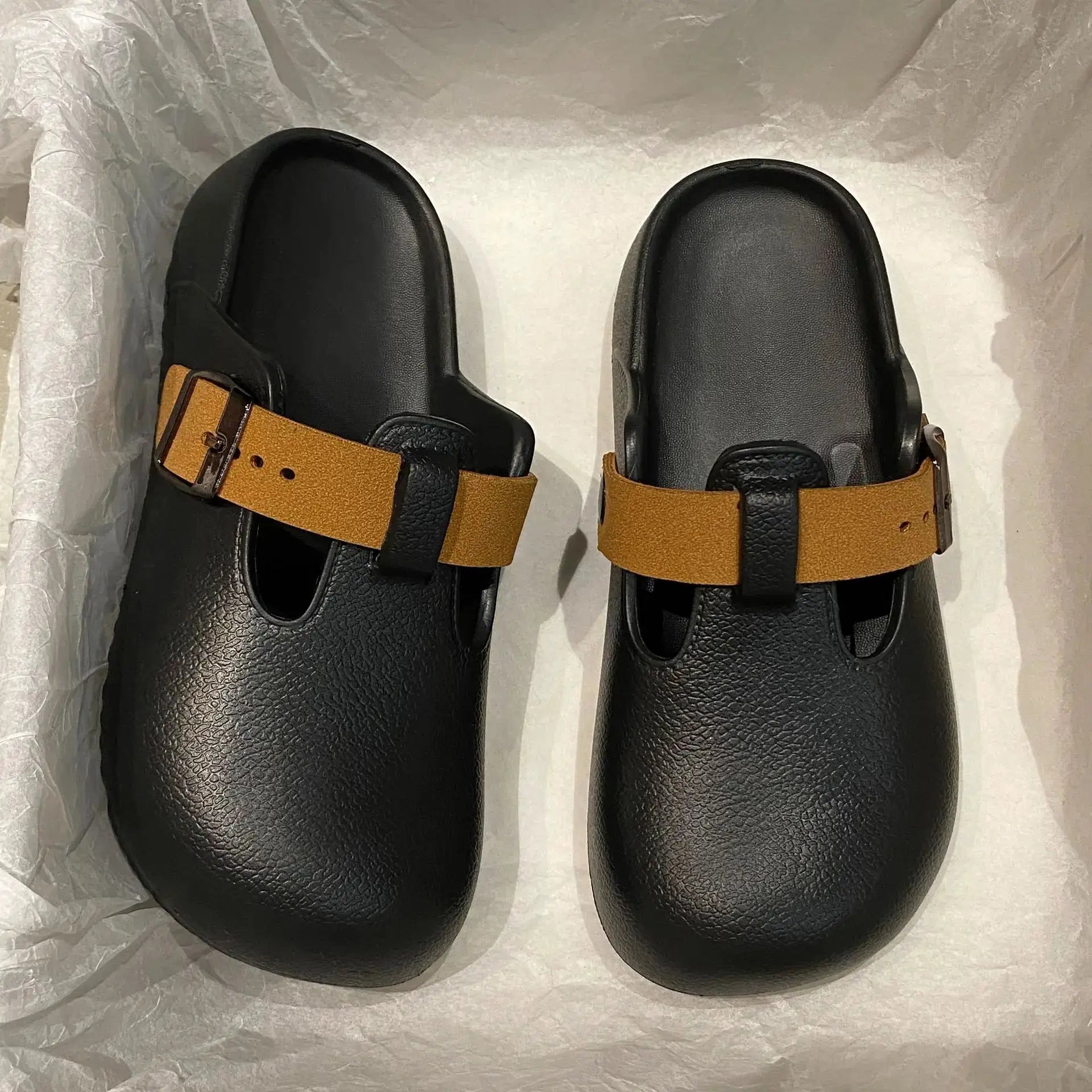 SmilePoP women's black EVA clogs with tan buckle strap, pair for outdoor garden use.