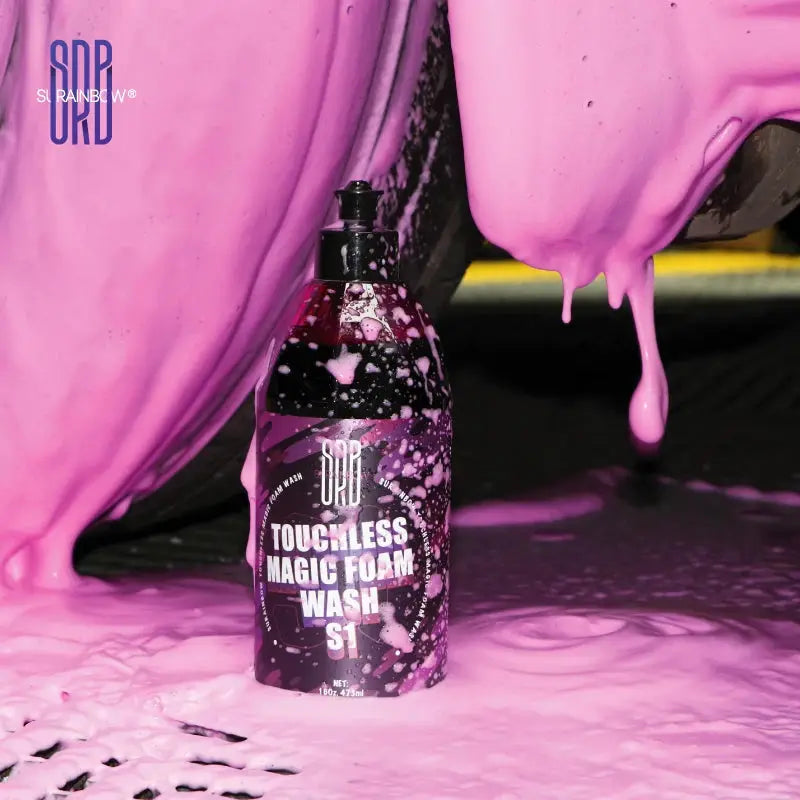 Pink foaming snow foam car wash soap bottle by Simples Market, Toughless Magic Foam Wash S1, surrounded by pink foam.