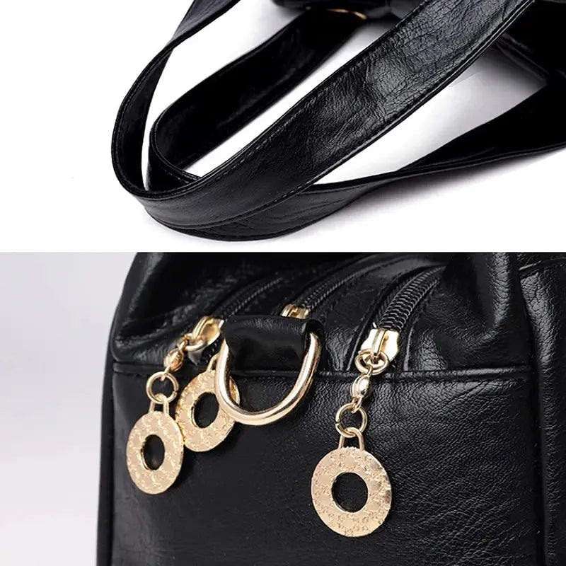 Women’s black leather multi-layer top-handle bag by Simples Market with gold hardware and circular charms.