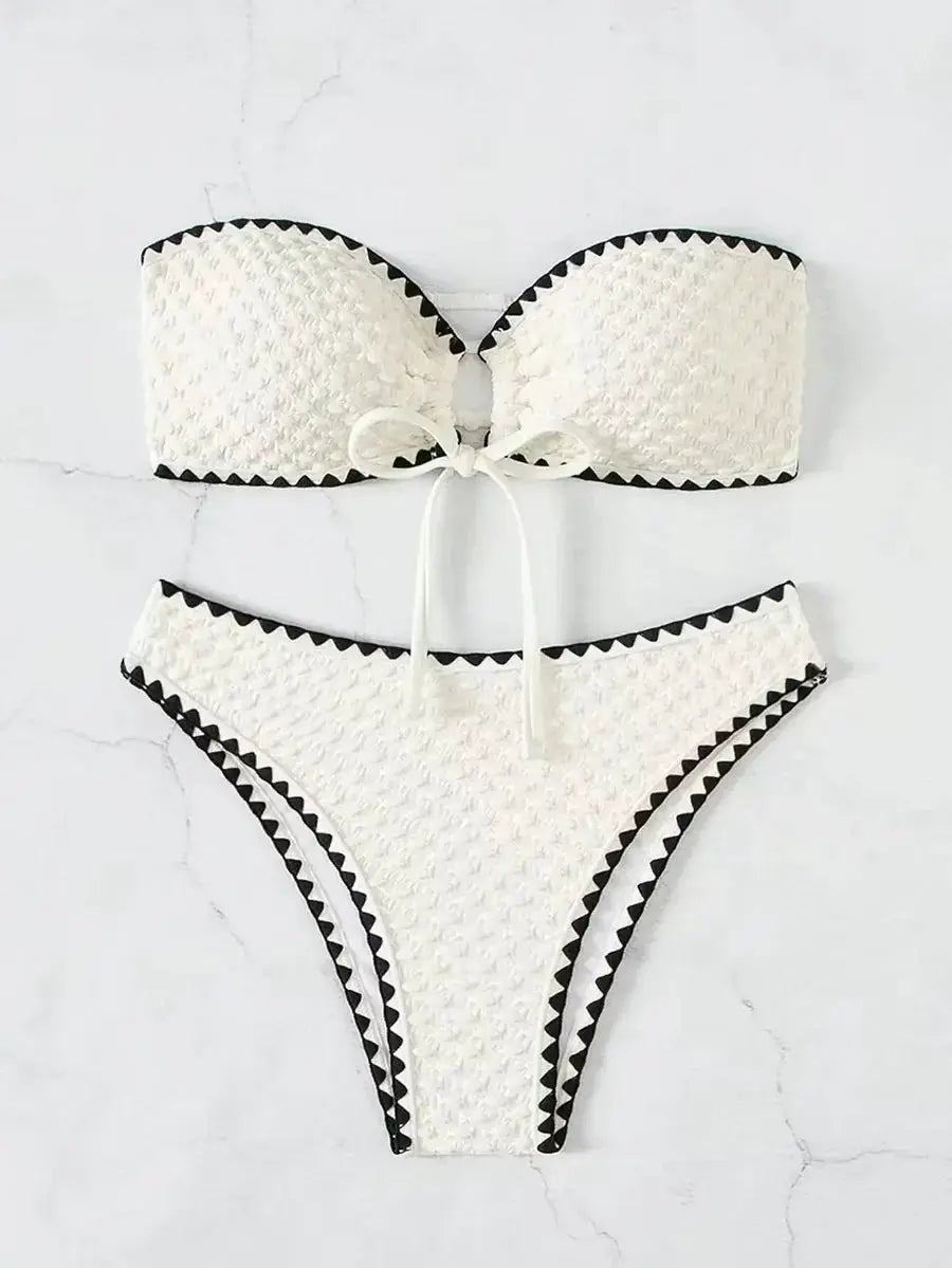 Simples Market white 2-piece strapless bandeau bikini with black trim and bow accents