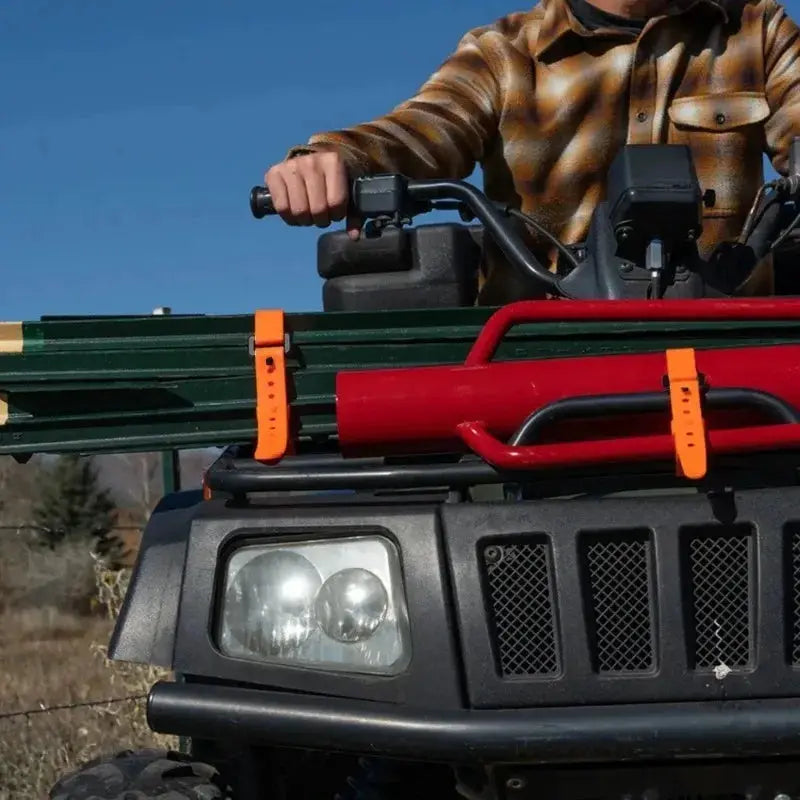 Rubber cargo strap set, orange tension straps 1-5 pcs securing gear on a vehicle roof rack.