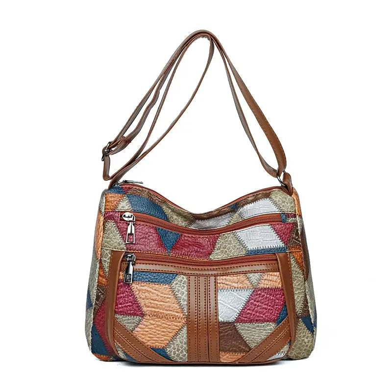 Women's Crossbody Shoulder Bag with colorful geometric patchwork, leather trim, and multiple zip pockets