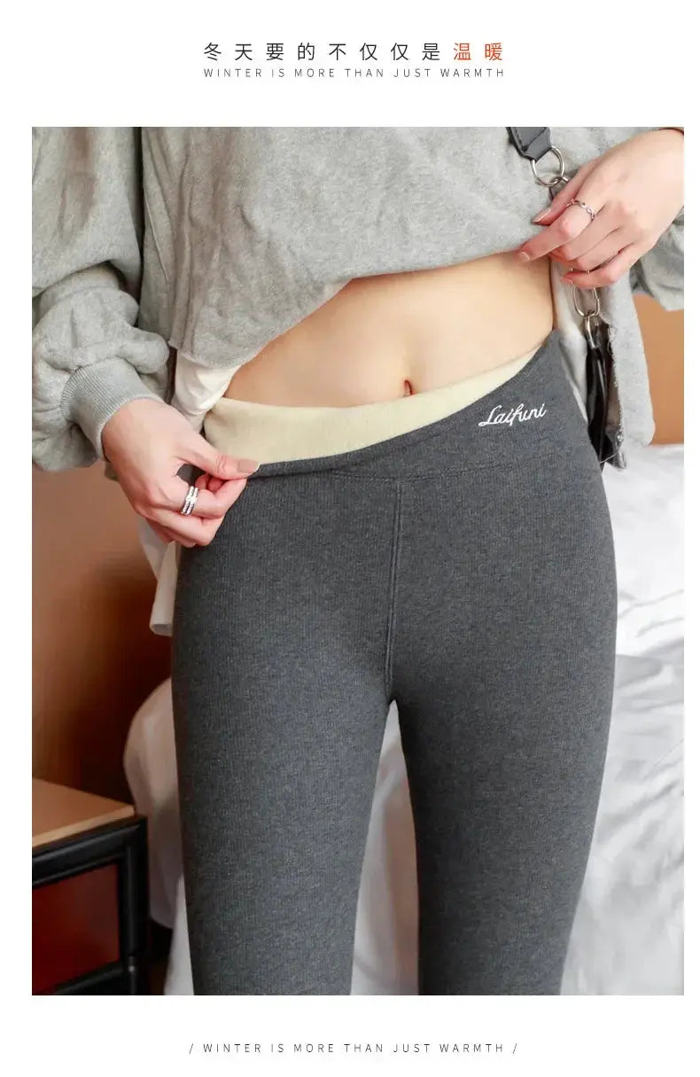 Women's grey thermal leggings, high-waist with beige inner waistband and visible logo