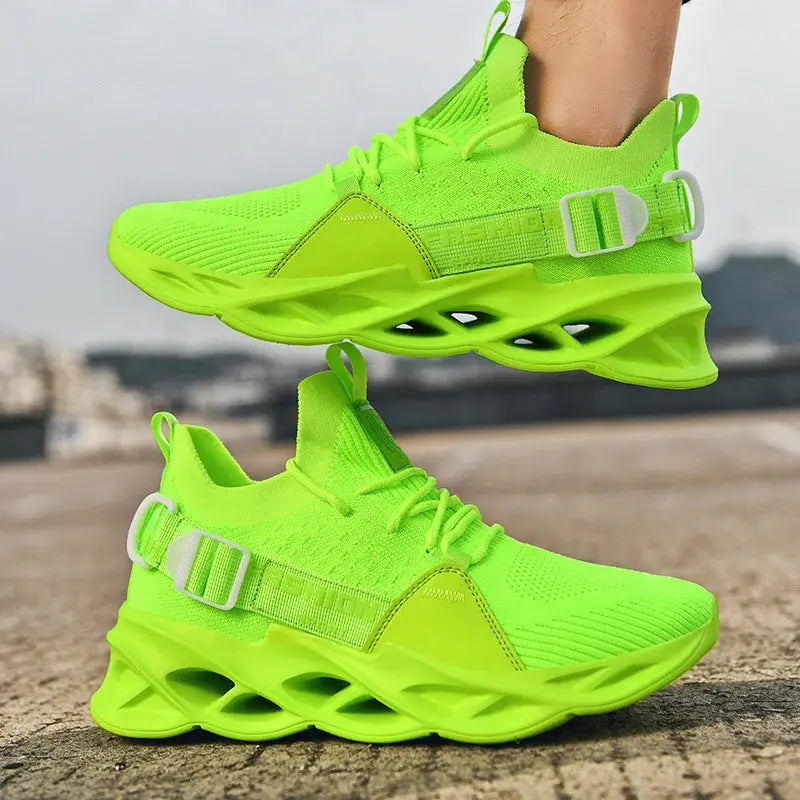 Sneakers unisex neon lime green mesh with a chunky hollowed-out sole and buckle strap, two shoes.