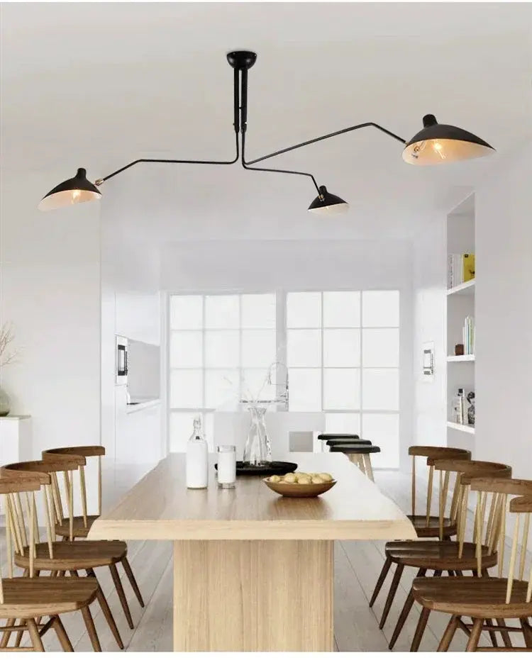 Simples Market modern spider pendant light, black metal LED ceiling lamp with three arms over a wooden dining table