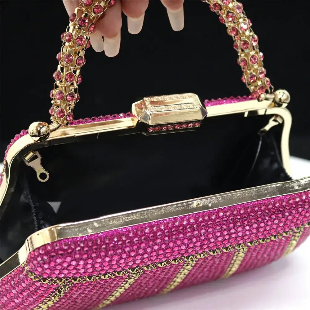 Evening clutch bag with pink rhinestones, gold-tone frame and jeweled chain handle
