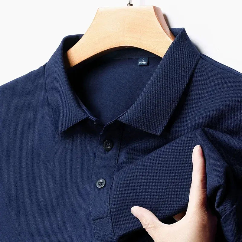 Men's navy polo shirt; solid short-sleeve knit with collar and two-button placket