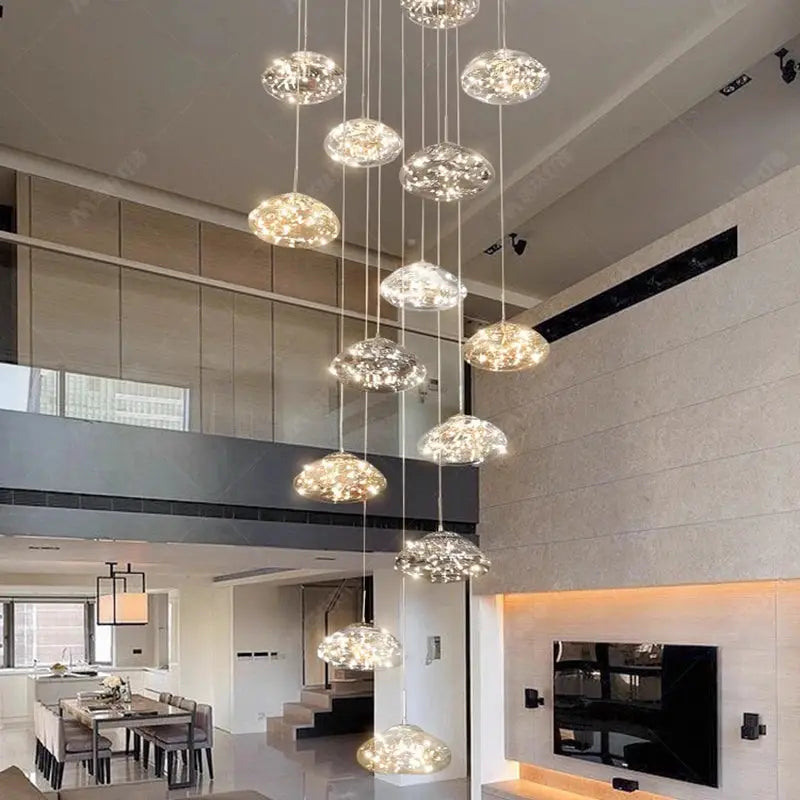 Pendant lights: cluster of glass disc pendants with LED illumination over a modern dining room