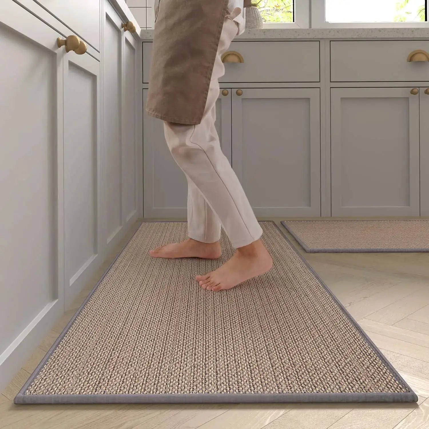 Two Simples Market washable kitchen rug runners with natural rubber backing; beige woven centers and gray borders.