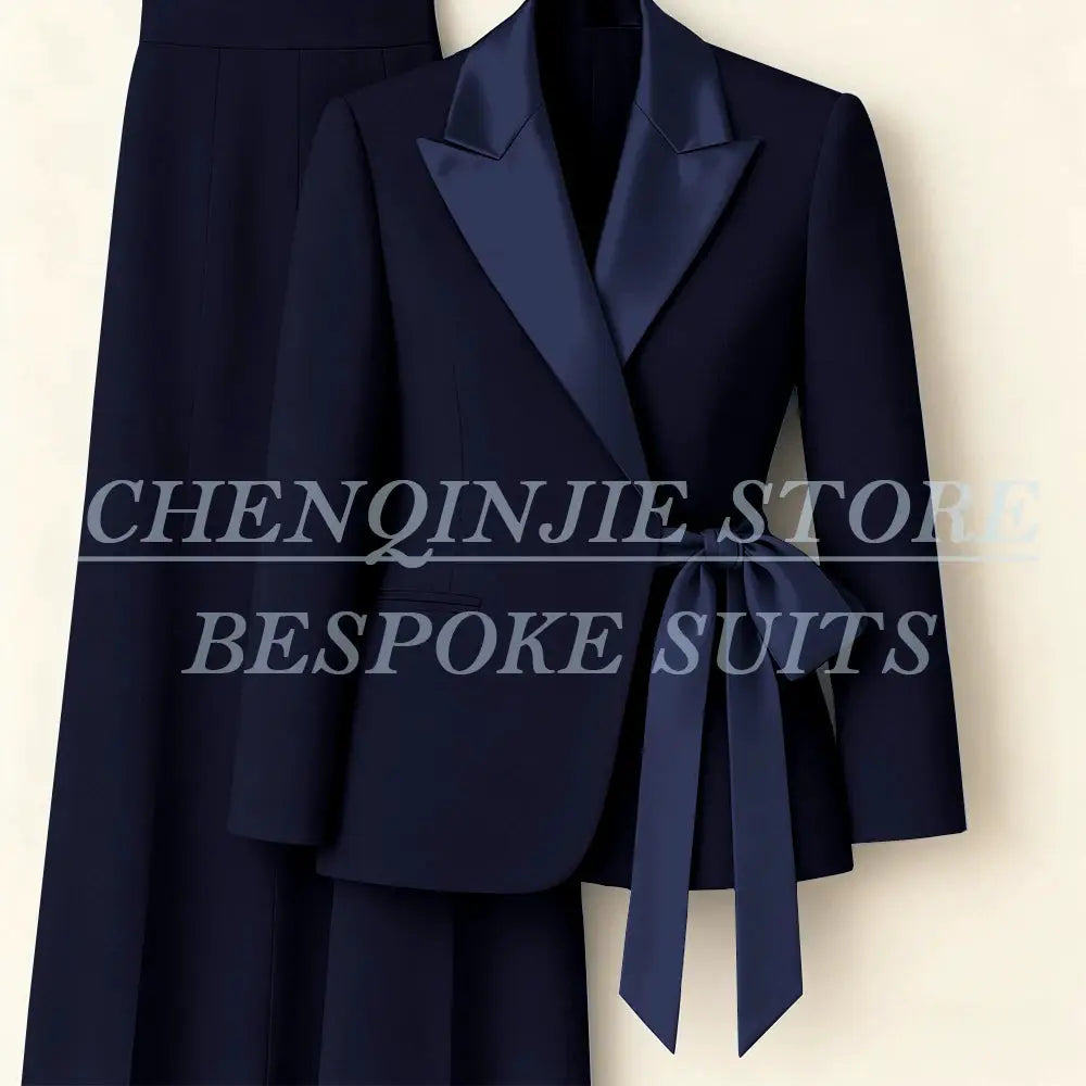 Navy 2-piece women's suit blazer with satin peak lapels and waist tie, matching pants set by Simples Market