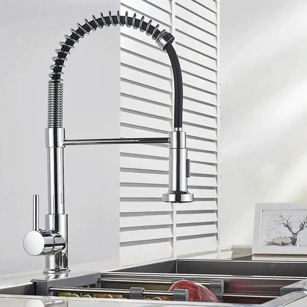 Spring pull-down kitchen faucet with chrome finish, deck-mounted mixer and flexible spring gooseneck spray head.