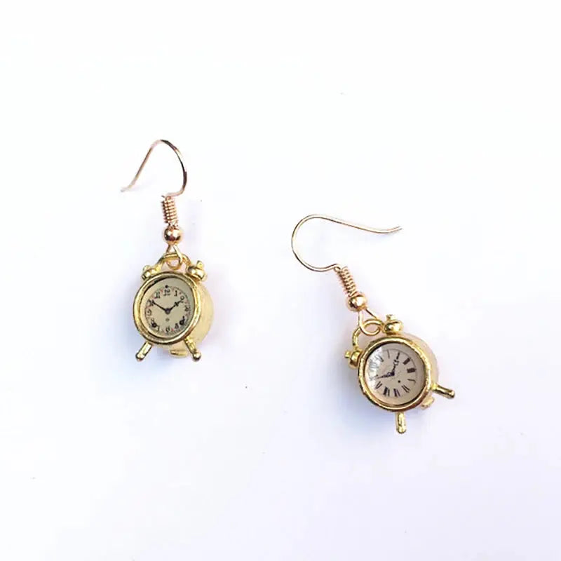 Gold-tone clock earrings pair featuring miniature vintage alarm clock design