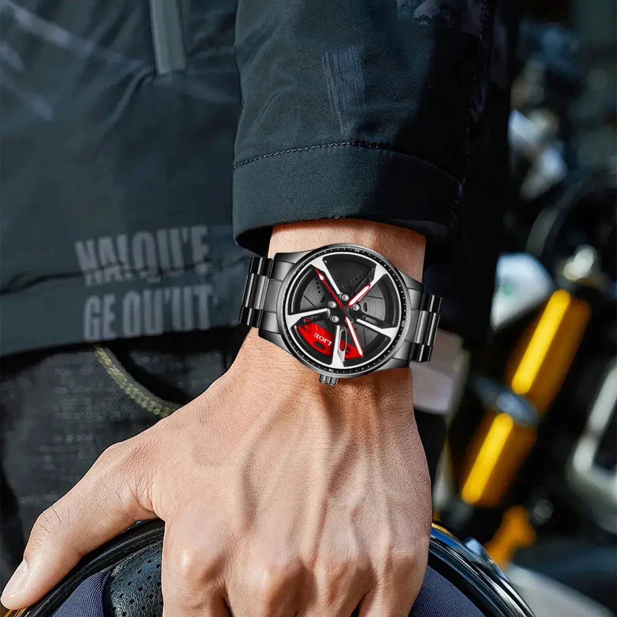 LIGE sport wristwatch with black stainless steel strap and round car-wheel dial with red accents, worn on a man's wrist