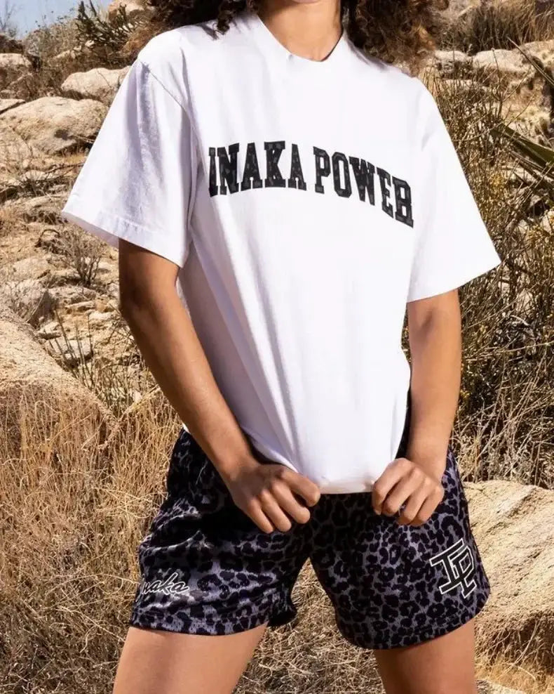 Mens quick-dry athletic shorts with black leopard print for gym and beach workouts