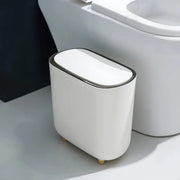 Slim white bathroom trash can with lid and chrome rim by Simples Market