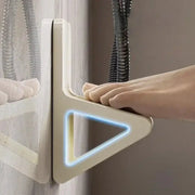 Simples Market foot-massage wall-mount accessory, beige plastic with a blue-lit triangular frame.