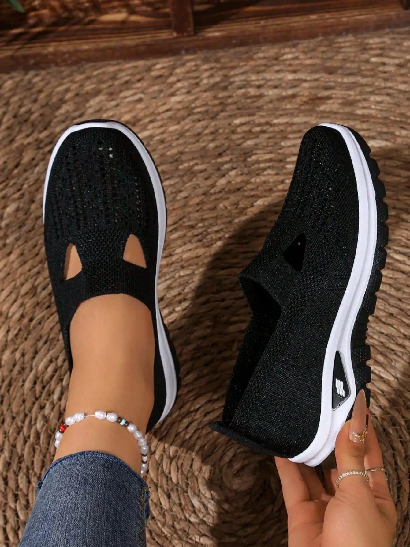 Women's casual mesh sneakers with cut-out T-strap and cushioned wedge sole, black knit upper, Simples Market pair.