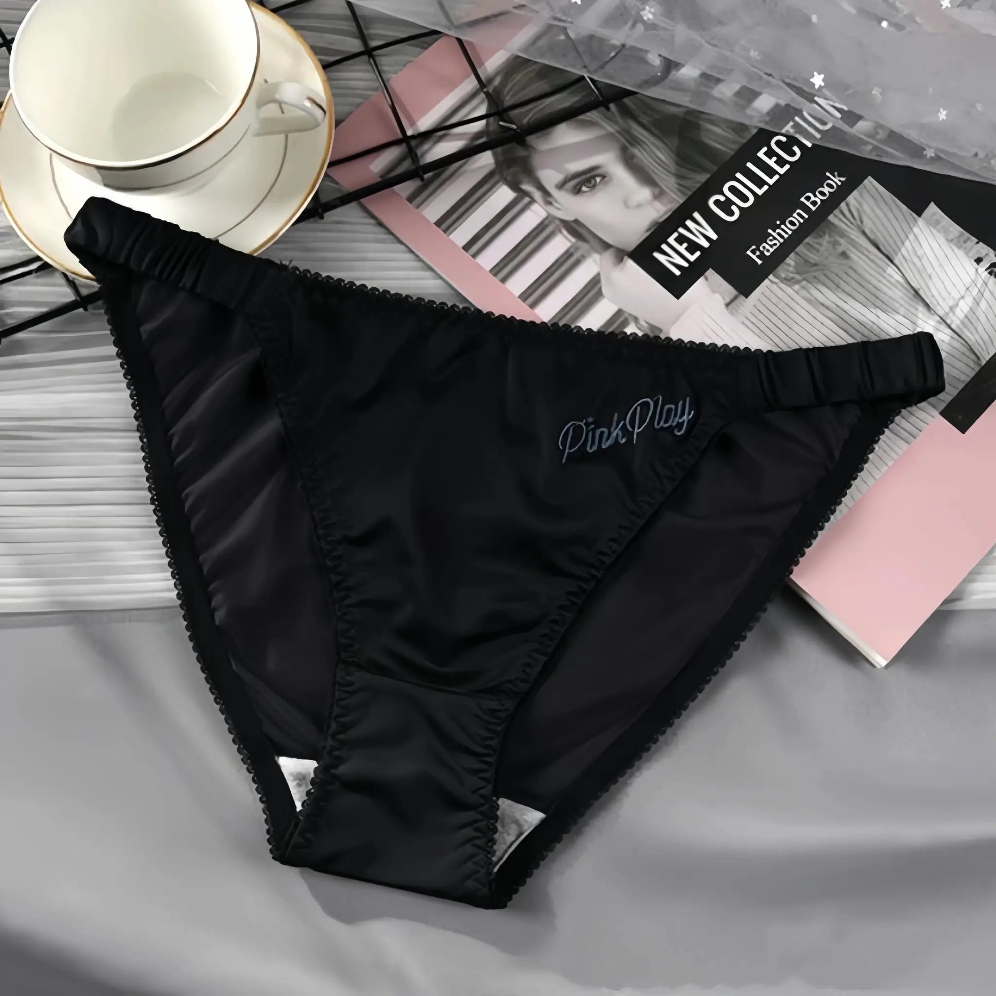 Girls satin panties with PinkPlay embroidery, black with elastic waistband.