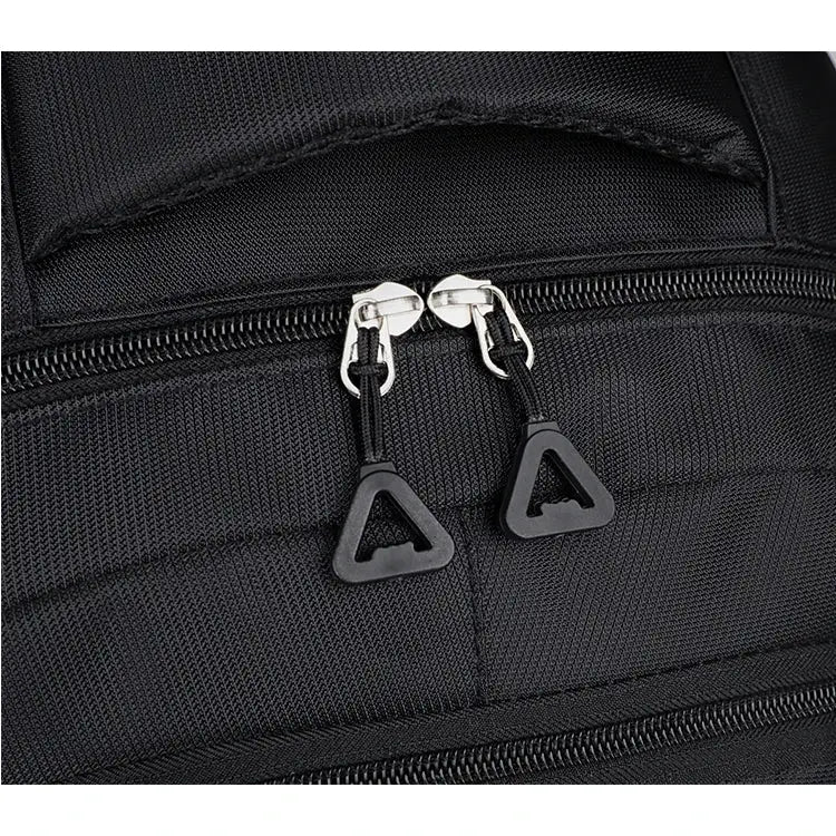 Travel backpack with large capacity and black durable fabric, dual zipper pulls.