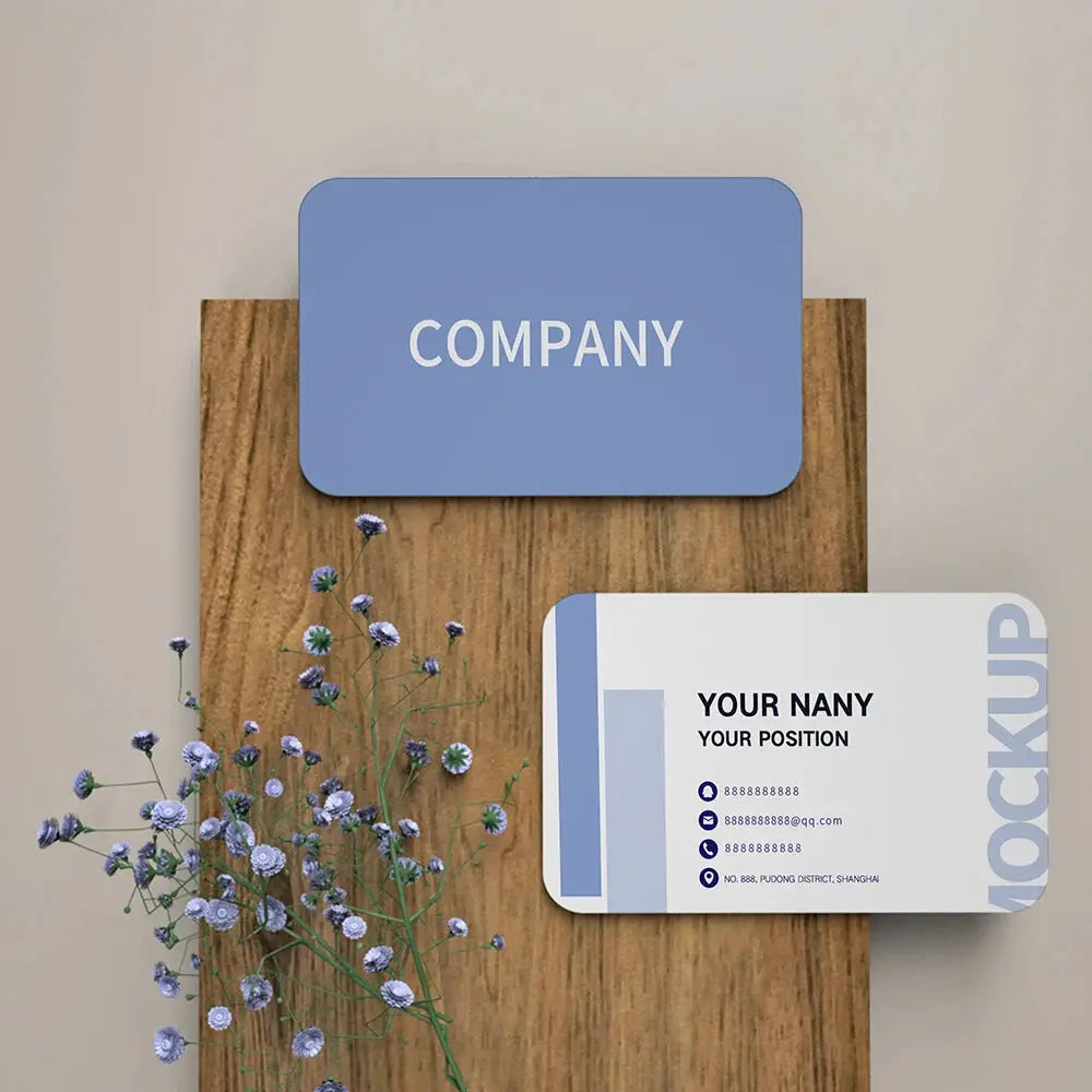 Custom business card mockup: two cards, blue rounded COMPANY card and white contact card with blue accents on wood.
