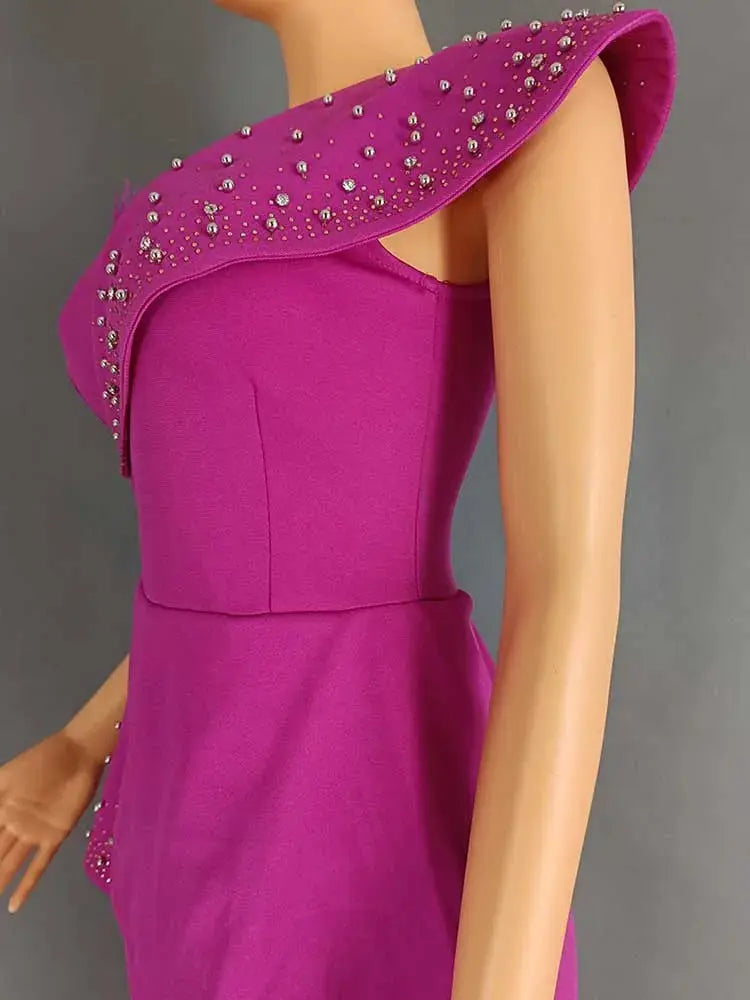 Simples Market magenta high-waist strapless jumpsuit with bejeweled rivet collar.