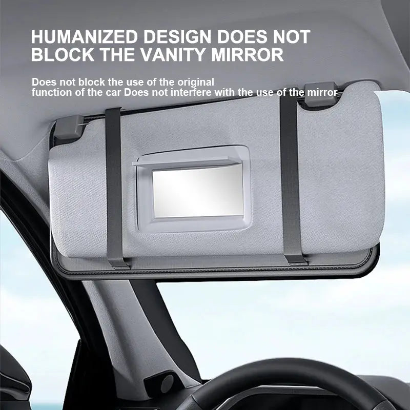 Car sun visor organizer in gray leather with sunglasses holder, card pockets, and built-in mirror