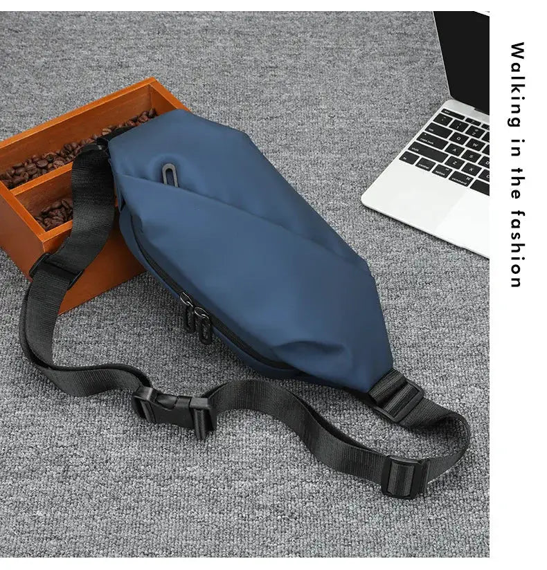 Blue nylon waist bag with black adjustable strap and zippered pockets.