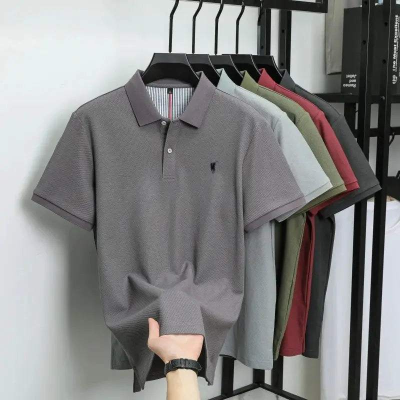 Six polo shirts on rack; gray 100% cotton polo with Paul Pony embroidery