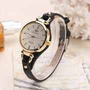 RINNADY women's quartz watch with gold-tone case, silver dial, black leather strap.