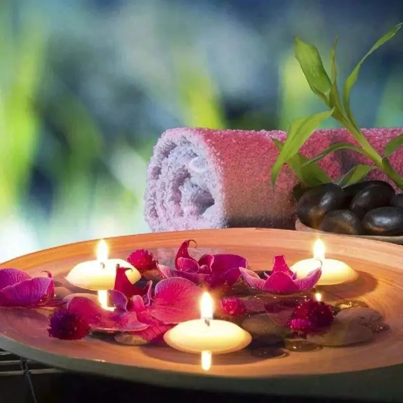 Simples Market floating disc candles, unscented, 4 candles in a water bowl with pink petals