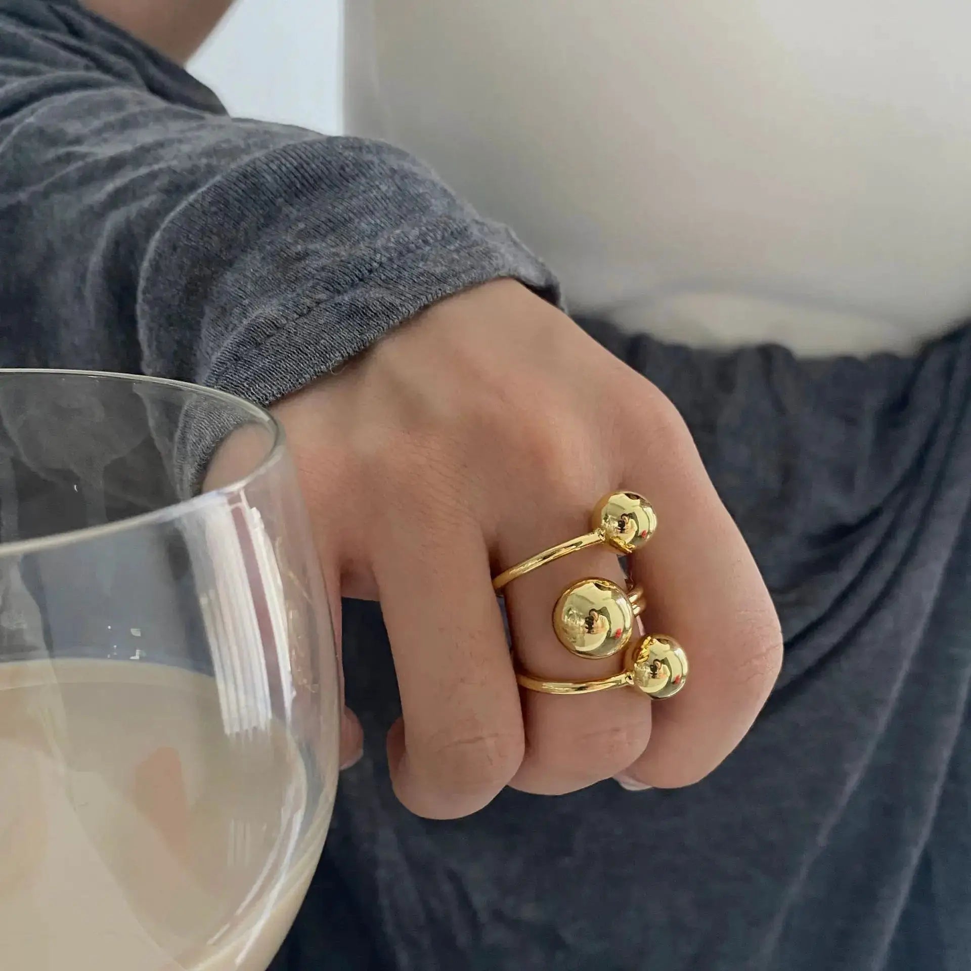 Exaggeration Punk Metal Ring Set for Women, gold-tone, irregular three-layer ball design, adjustable.