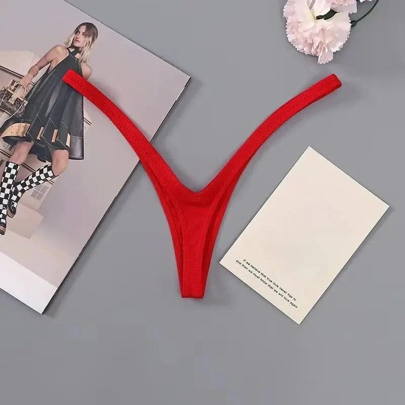 Thong underwear in red with deep V low-waist cut and soft thin straps.