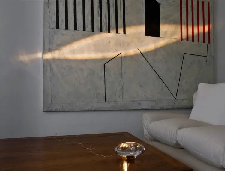 Simples Market egg-shaped crystal LED table lamp on a wooden coffee table in a living room
