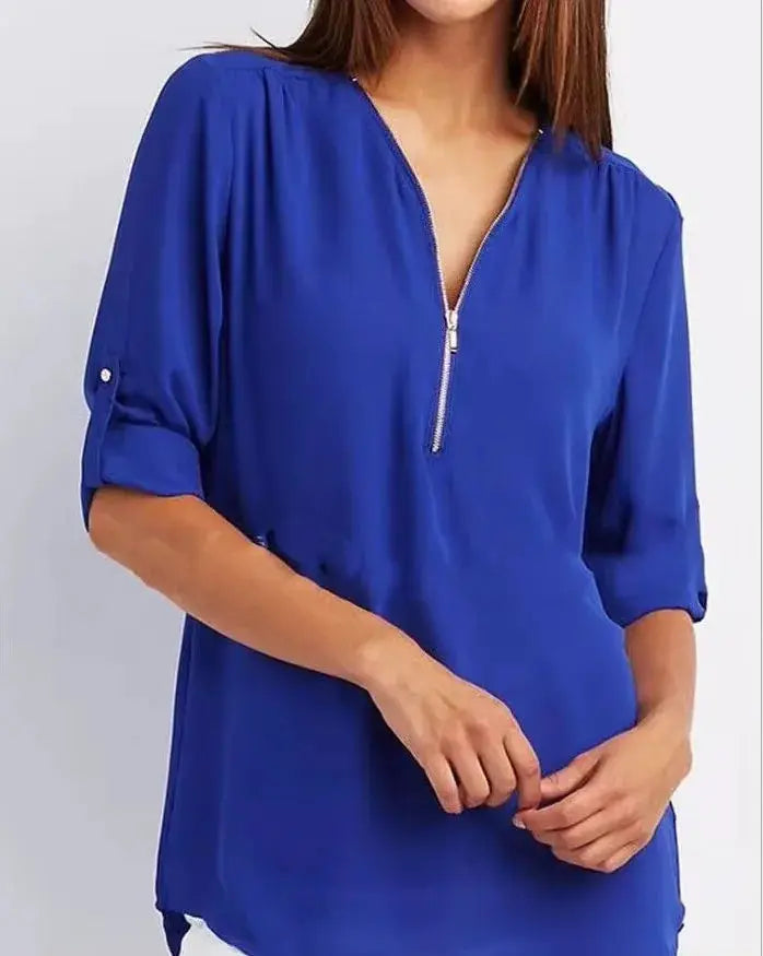 Blue women's chiffon blouse with deep V-neck zipper, loose fit and rolled sleeves