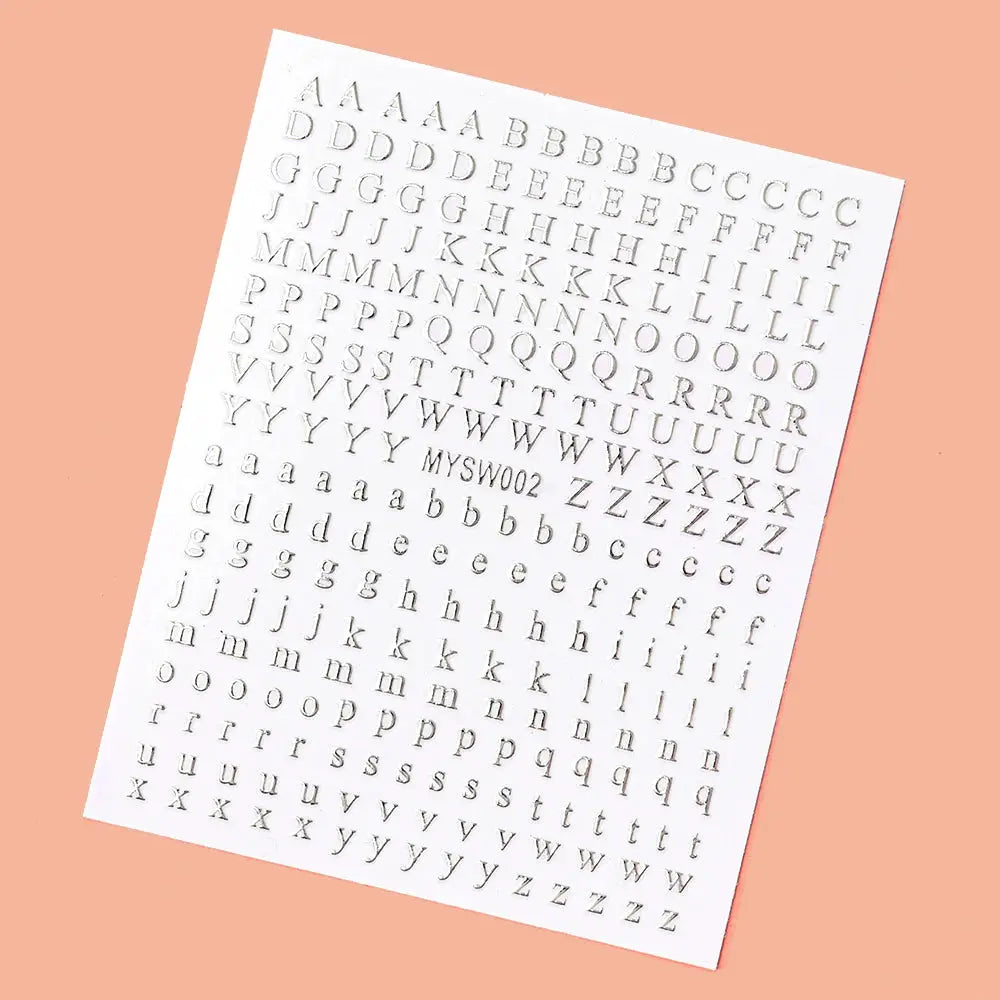 3D alphabet nail stickers by Simples Market, laser silver/gold sheet with 26 uppercase letters, self-adhesive 8x10 cm.