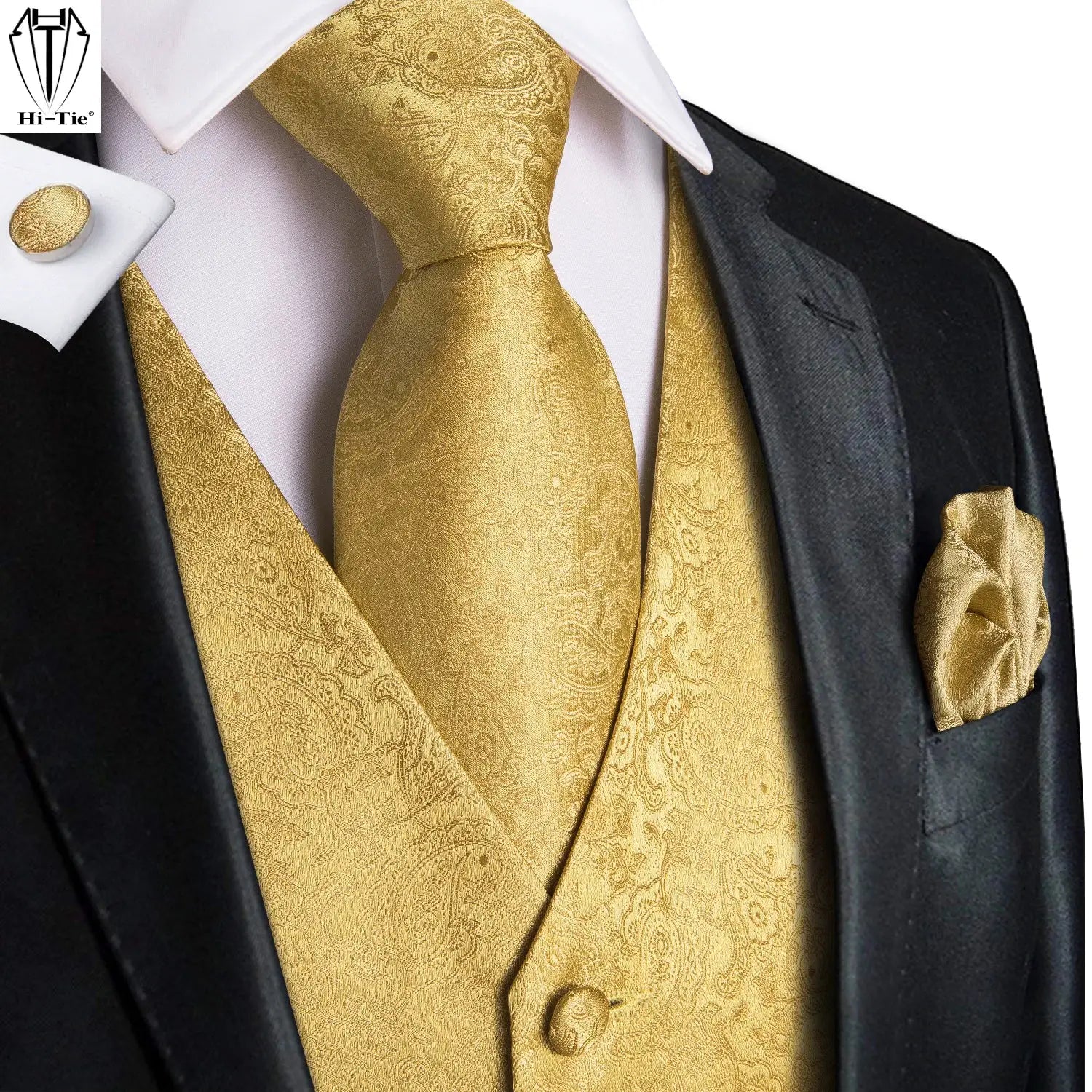 Hi-Tie gold paisley waistcoat and tie set on a black tuxedo with gold pocket square