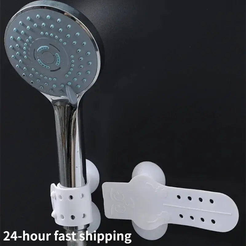 Simples Market suction cup shower head holder with white plastic bracket and chrome handheld shower head.